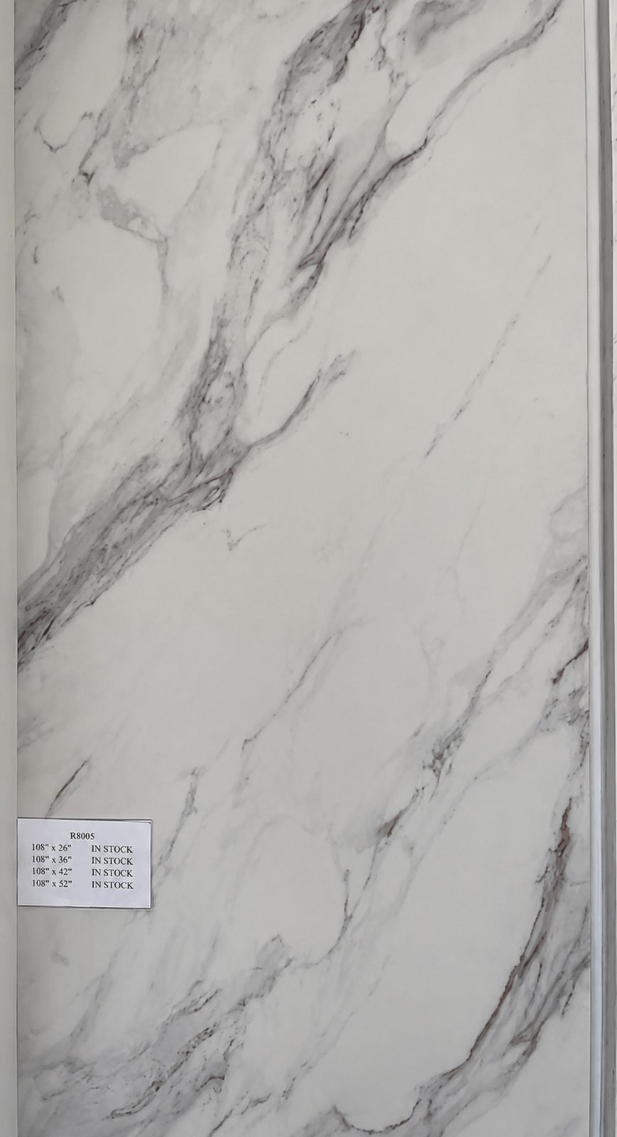 White marble with dramatic purple-gray and gold veining. — full slab