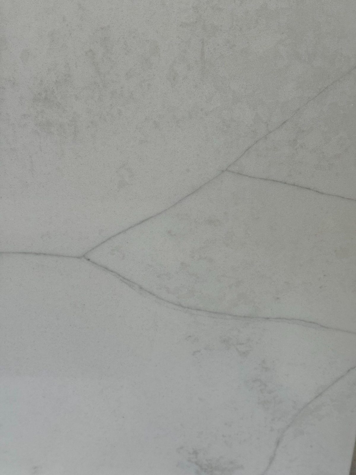 White quartz with faint, fine gray veining.