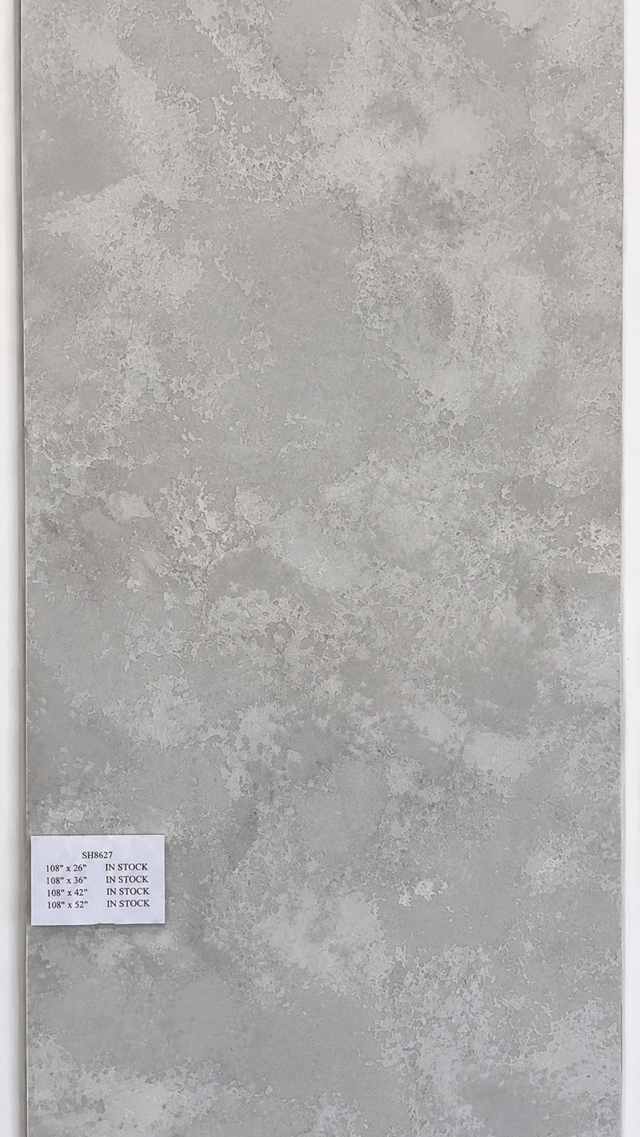 Warm gray quartz with cloudy mineral mottling. — full slab