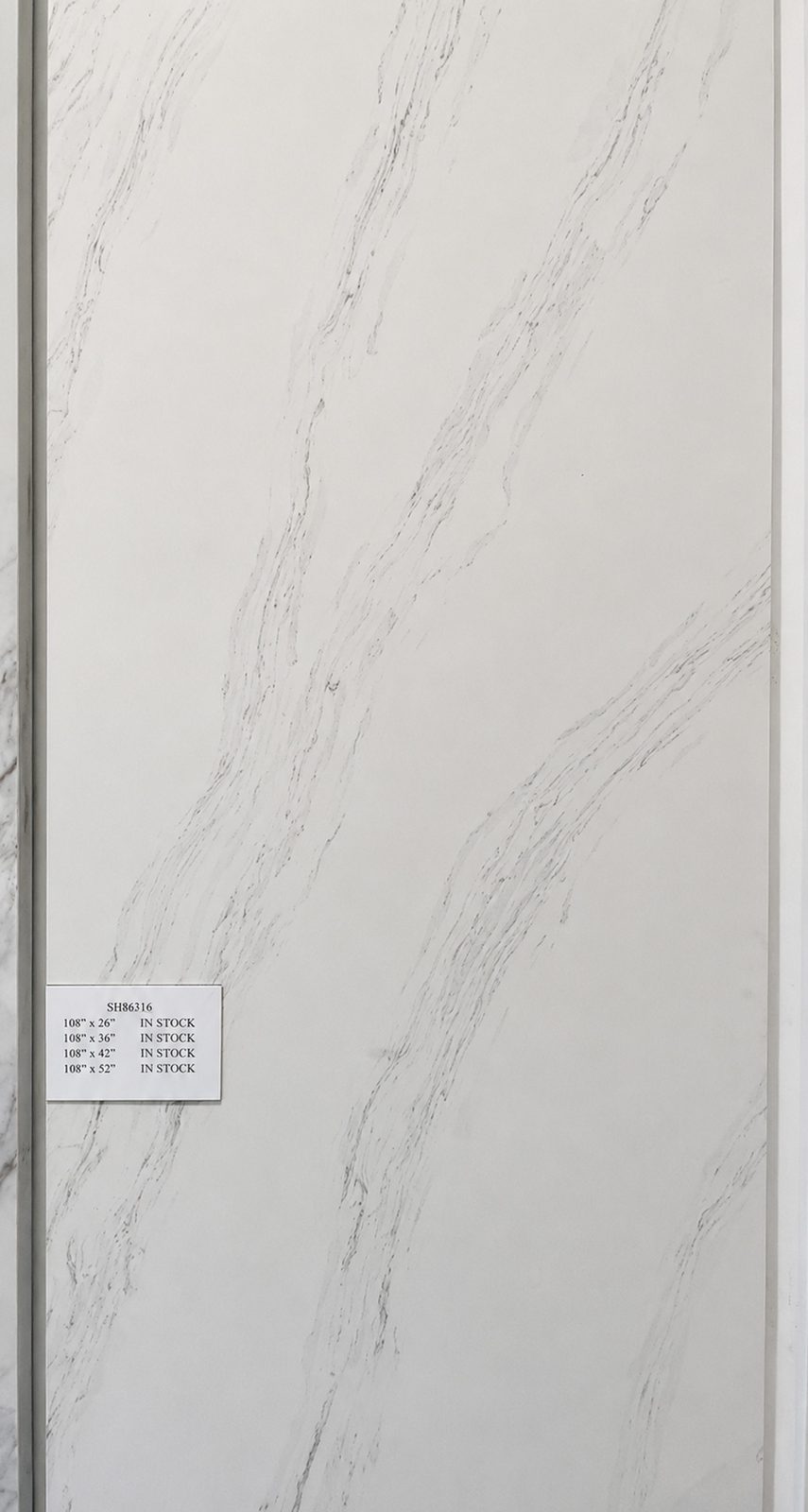 White quartz with delicate brown-gold veining. — full slab