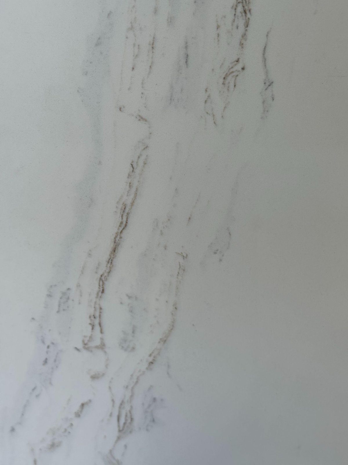 White quartz with delicate brown-gold veining.