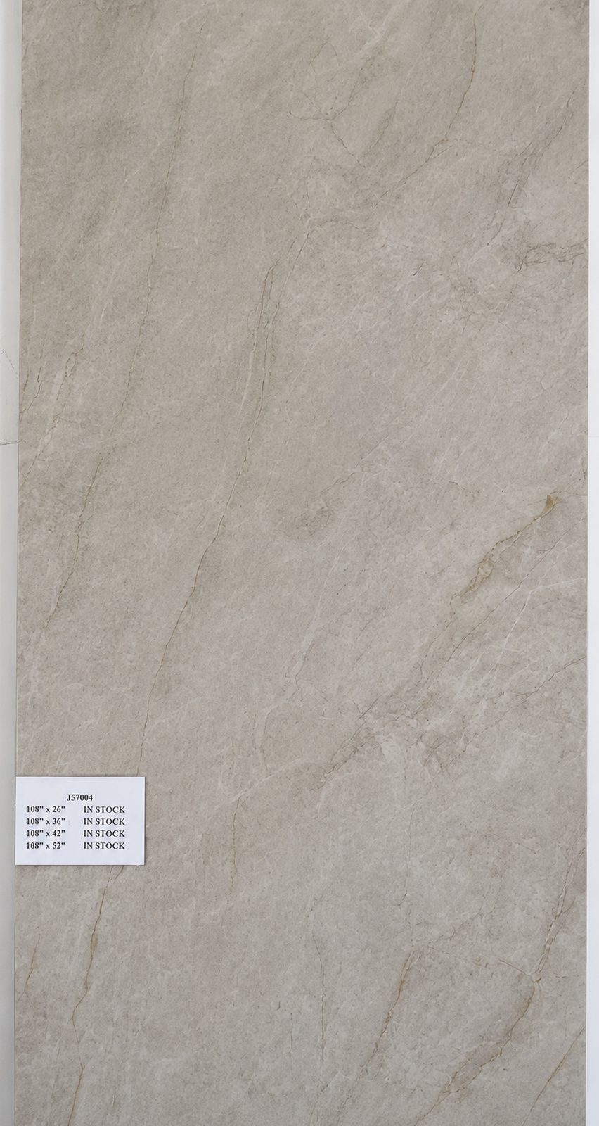 Cream Taj Mahal quartzite with golden-brown veining. — full slab