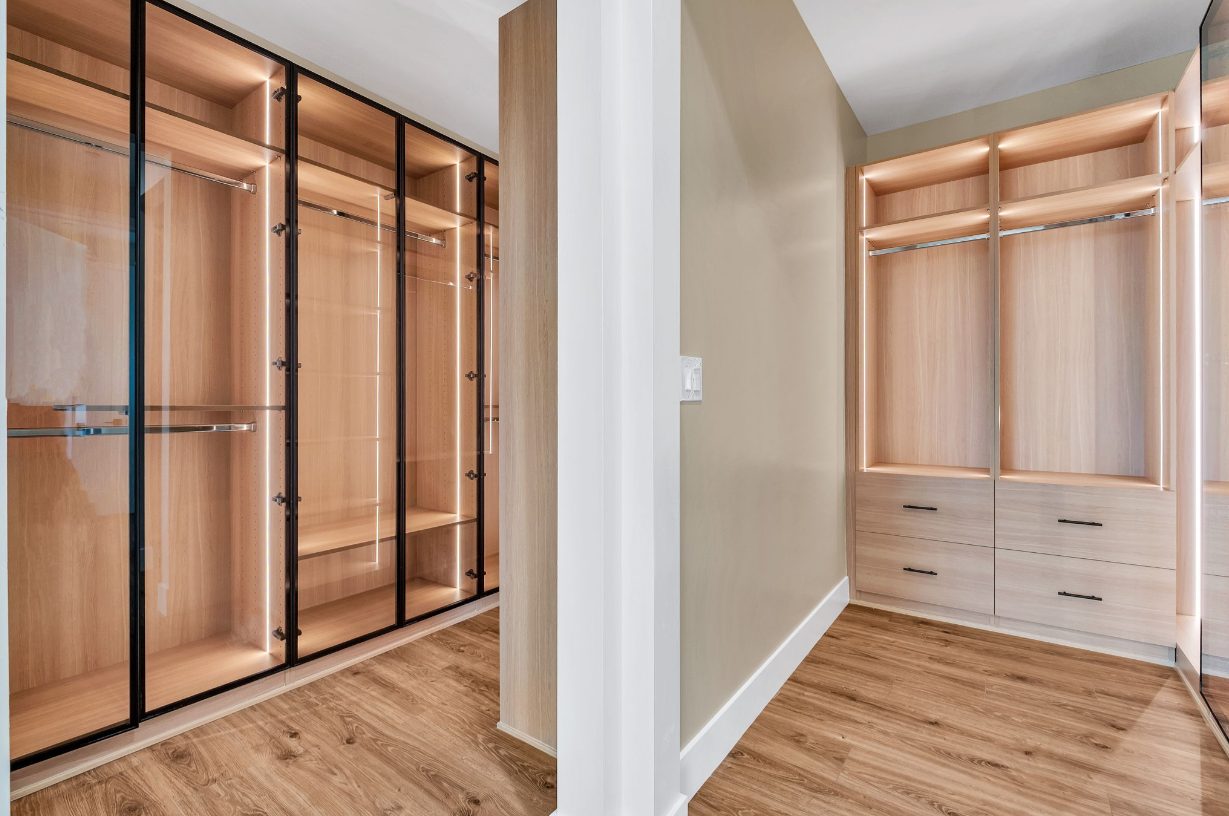 Oak wardrobe with glass display doors and an open hanging section.